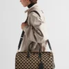 Bolso de viaje mediano de tela con el símbolo de Prada bordado Bolso de viaje mediano de tela con el símbolo de Prada bordado