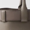 Bolso grande de piel con hebilla Prada y cinturón