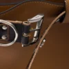 Bolso grande de piel con hebilla Prada y cinturón con tachuelas Bolso grande de piel con hebilla Prada y cinturón con tachuelas