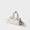Bolso pequeño Prada Bonnie de lino estampado y piel Bolso pequeño Prada Bonnie de lino estampado y piel