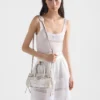 Bolso pequeño Prada Bonnie de lino estampado y piel Bolso pequeño Prada Bonnie de lino estampado y piel