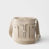 Bolso tipo cubo Prada Route Mini de lona y piel