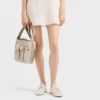 Bolso tipo cubo Prada Route Mini de lona y piel