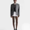 Chaqueta de lana con estampado de cuadros Príncipe de Gales y cierre de un solo botonero Chaqueta de lana con estampado de cuadros Príncipe de Gales y cierre de un solo botonero