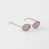 Gafas de sol Prada con la icónica placa metálica Gafas de sol Prada con la icónica placa metálica
