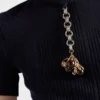 Jersey de lana de manga corta con colgante Jersey de lana de manga corta con colgante