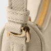 Mini bolso Prada Re-Edition 2005 de nubuck y piel Saffiano Mini bolso Prada Re-Edition 2005 de nubuck y piel Saffiano