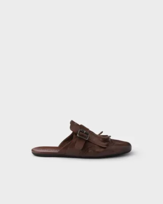 Mules de cuero envejecido Shuffle con correa con hebilla y flecos