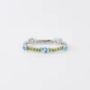 Pulsera Couleur Vivante – Oro blanco con aguamarina y peridoto Pulsera Couleur Vivante – Oro blanco con aguamarina y peridoto