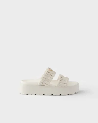Sandalias planas de piel napa matelassé