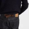 Vaqueros de denim sin tratar con tira de cuero Vaqueros de denim sin tratar con tira de cuero